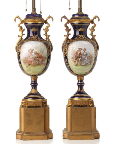 Appraisal: A PAIR TH C FRENCH GILT BRONZE AND PORCELAIN LAMPSThe