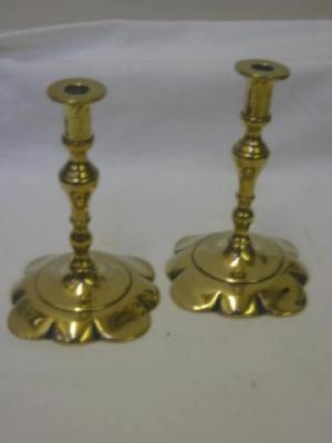 Appraisal: A PAIR OF VICTORIAN BRASS TAPERSTICKS of turned baluster form