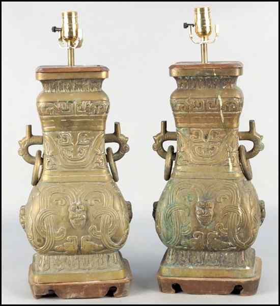 Appraisal: PAIR OF PATINATED BRONZE URNS FITTED AS TABLE LAMPS Urn