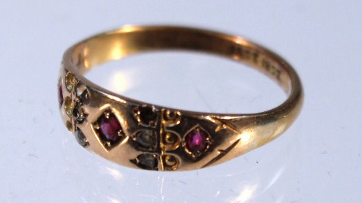 Appraisal: An Edwardian dress ring set with garnet and white stones