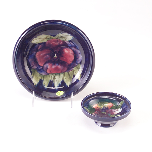 Appraisal: MOORCROFT Two footed bowls the larger in the Pansy pattern