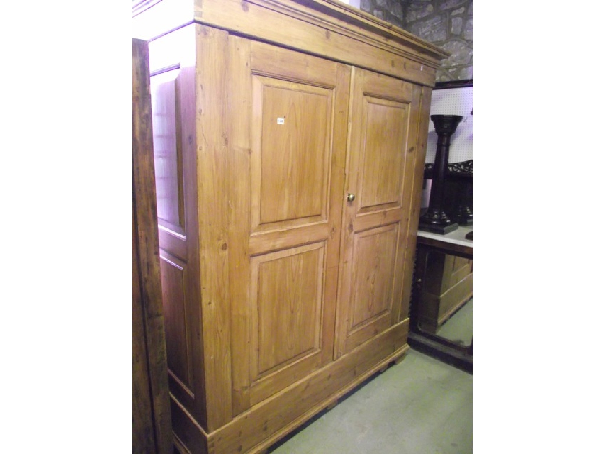 Appraisal: A th century continental stripped and waxed pine knockdown wardrobe