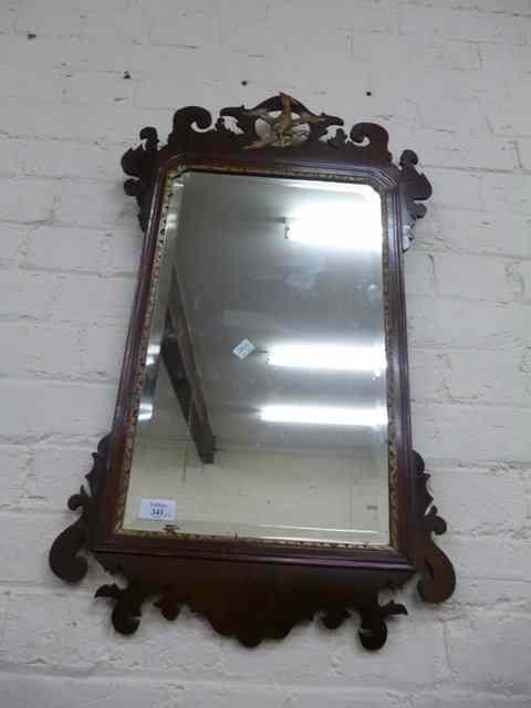 Appraisal: A GEORGIAN STYLE MAHOGANY FRET FRAMED WALL MIRROR with ho-ho