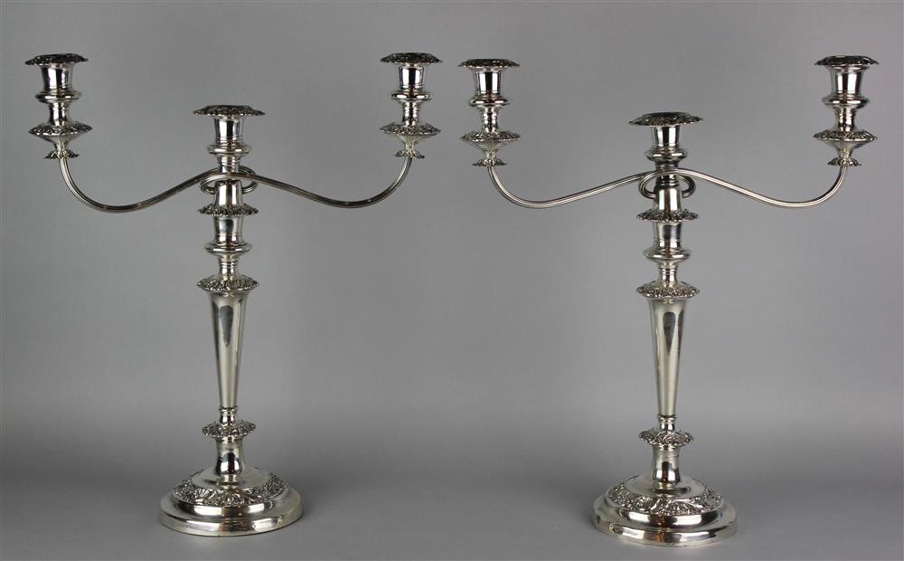 Appraisal: PAIR OF GEORGE III STYLE SILVERPLATED THREE LIGHT CANDELABRA the