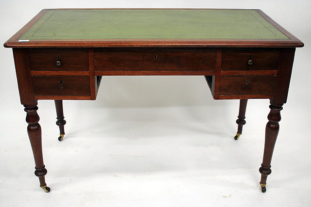 Appraisal: A VICTORIAN MAHOGANY WRITING TABLE with a green leather inset