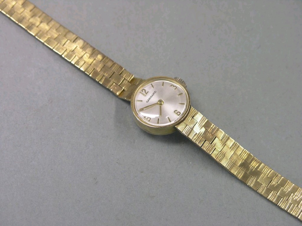 Appraisal: A lady's ct gold Garrard wristwatch on flexible ct gold