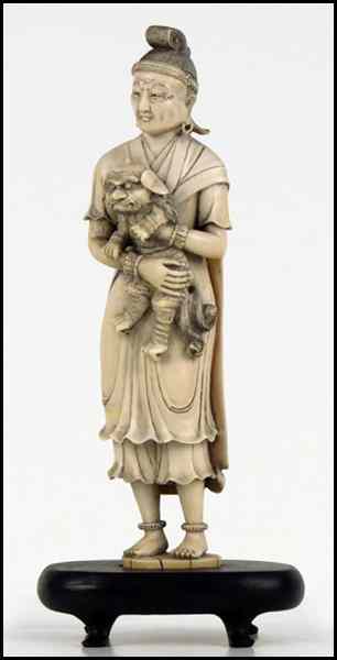 Appraisal: JAPANESE CARVED IVORY FIGURE OF A MAN AND A DOG