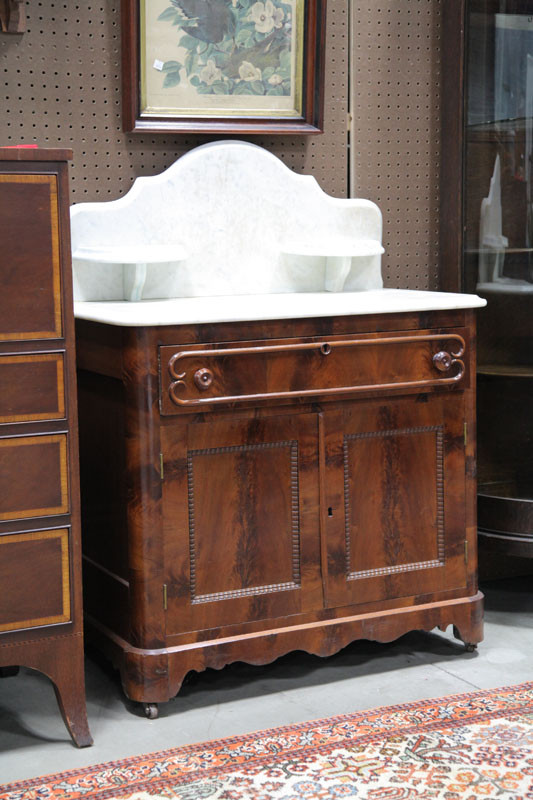 Appraisal: VICTORIAN COMMODE Marble top commode having a shaped gallery with