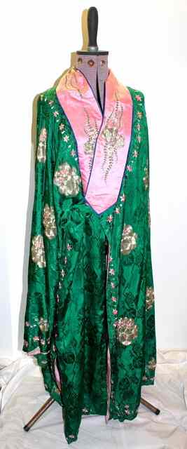 Appraisal: A CHINESE GREEN EMBOSSED SILK ROBE with satin lining embroidered