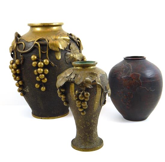 Appraisal: Three bronze vases with grapevine and leaf decoration two with