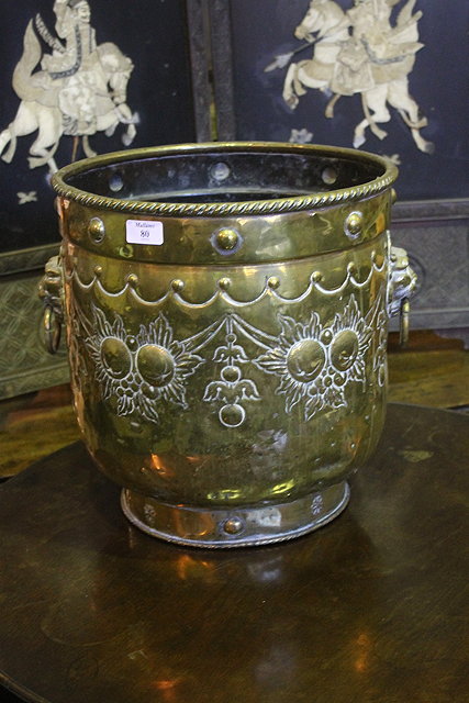 Appraisal: A DUTCH STYLE BRASS EMBOSSED COAL BUCKET with lion mask