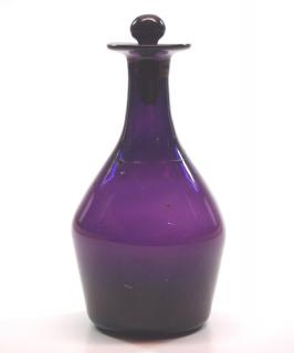 Appraisal: Free Two mid th century glass bottles Dark Amethyst free-blown