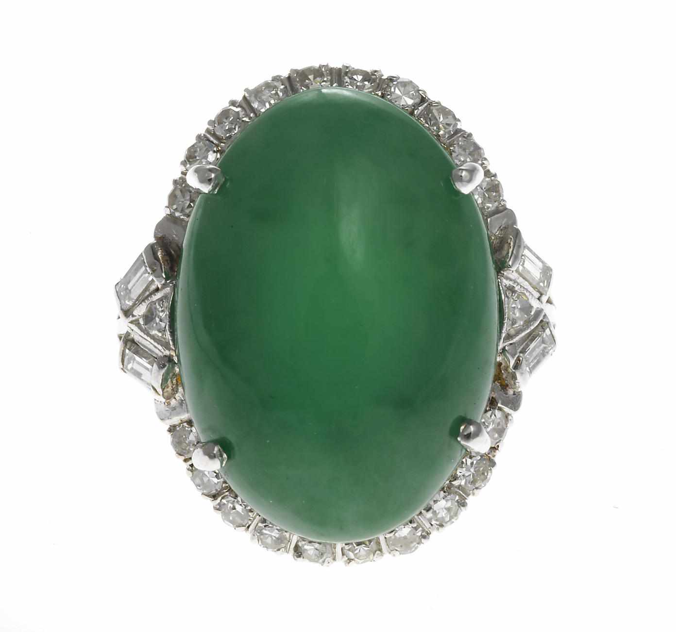 Appraisal: A jadeite jade and diamond ring oval-shaped jadeite jade cabochon