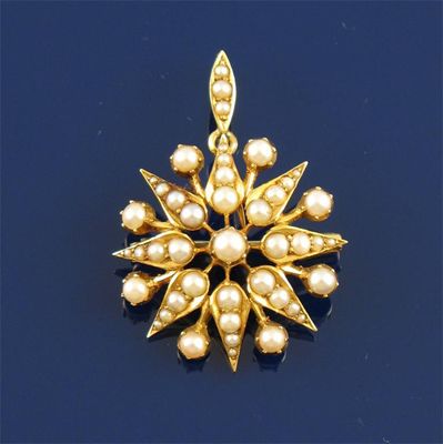 Appraisal: An Edwardian gold floral pendant brooch Set with graduated seed