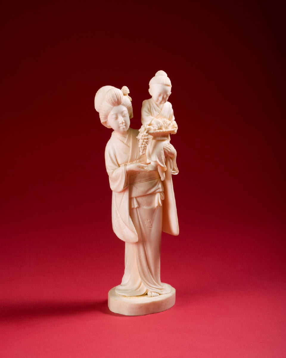 Appraisal: JAPANESE CARVED IVORY OF A WOMAN HOLDING A CHILD MEIJI