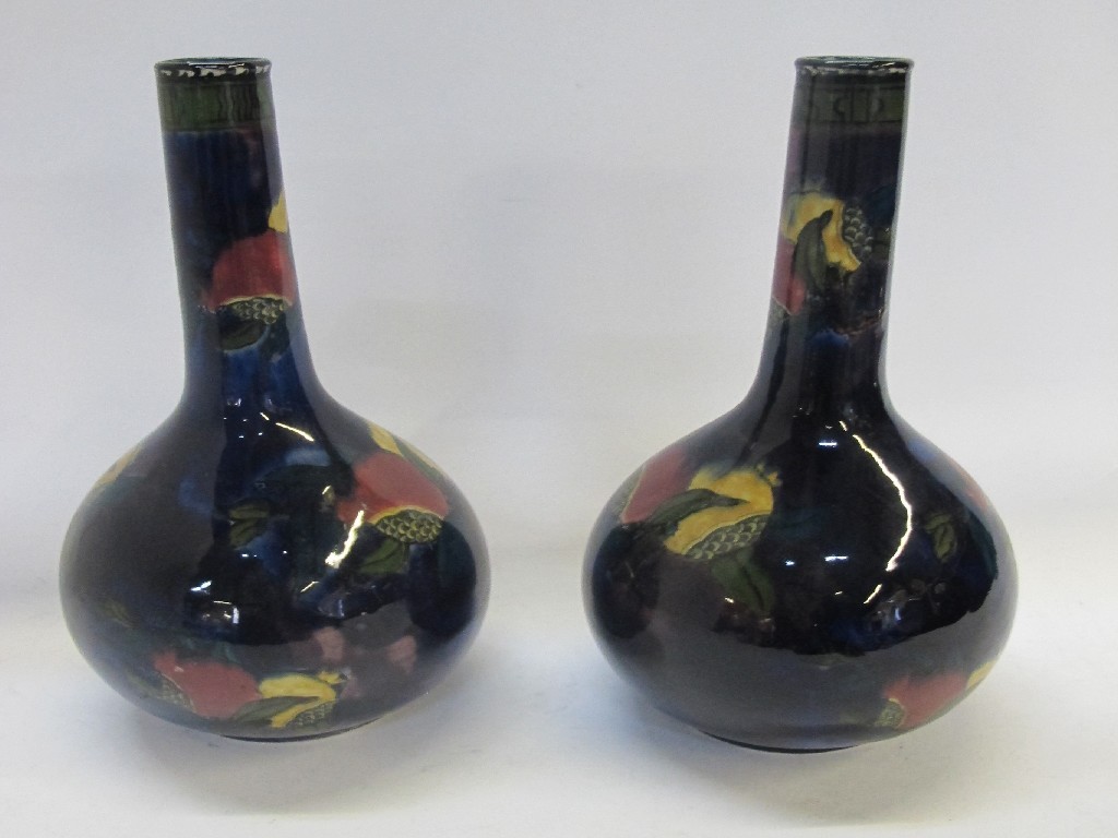 Appraisal: Pair of Rubens Ware Pomegranate bottle vases