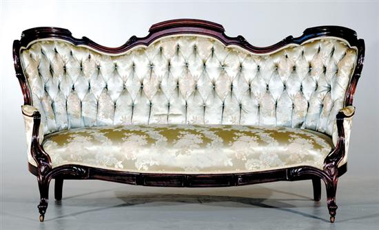 Appraisal: Renaissance Revival carved walnut sofa circa shaped and molded frame