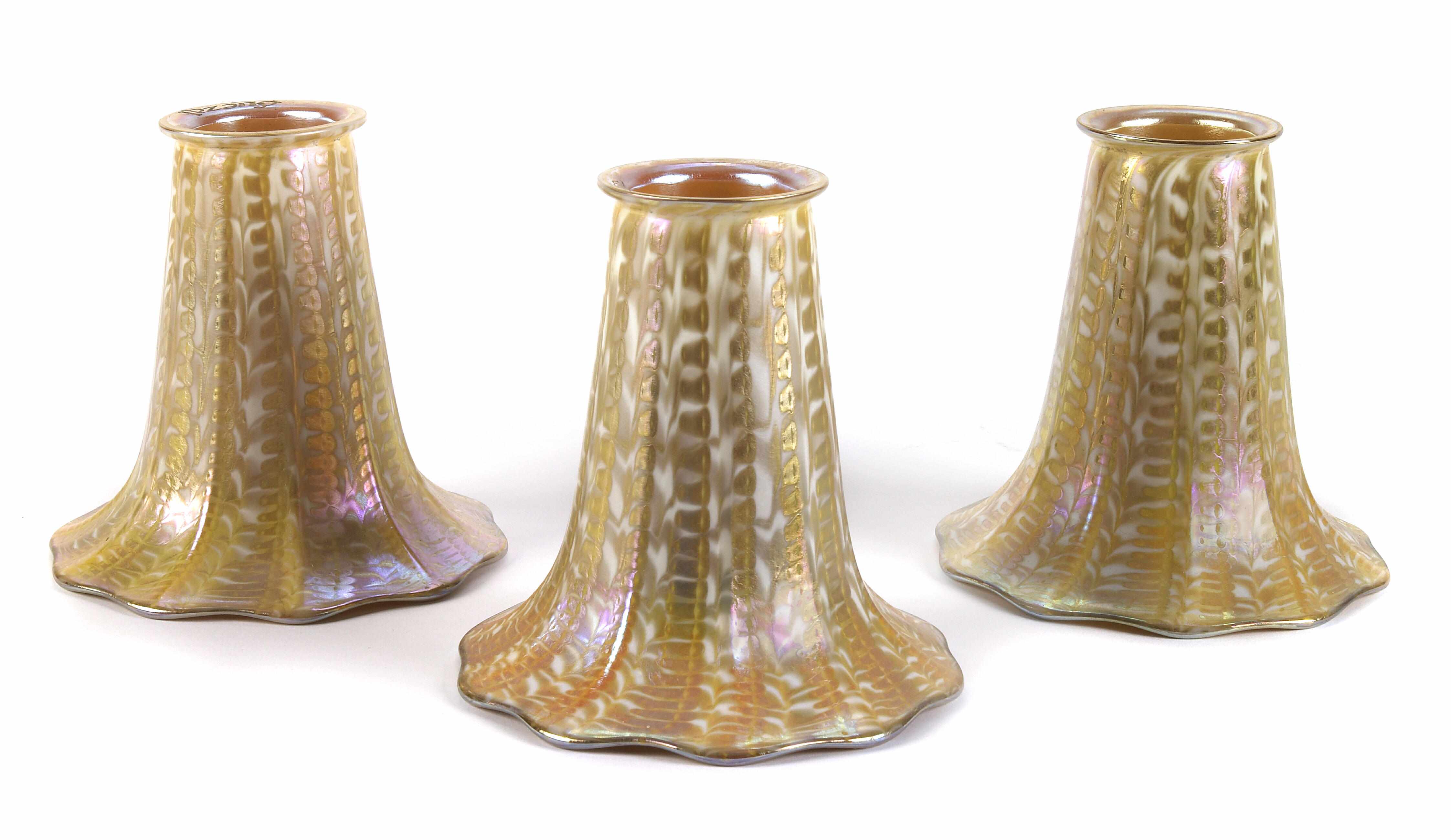 Appraisal: A set of eight Quezal decorated iridescent glass flori-form shades