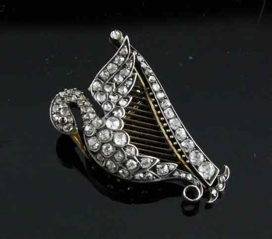 Appraisal: An Edwardian diamond set gold Hibernian harp brooch modelled with