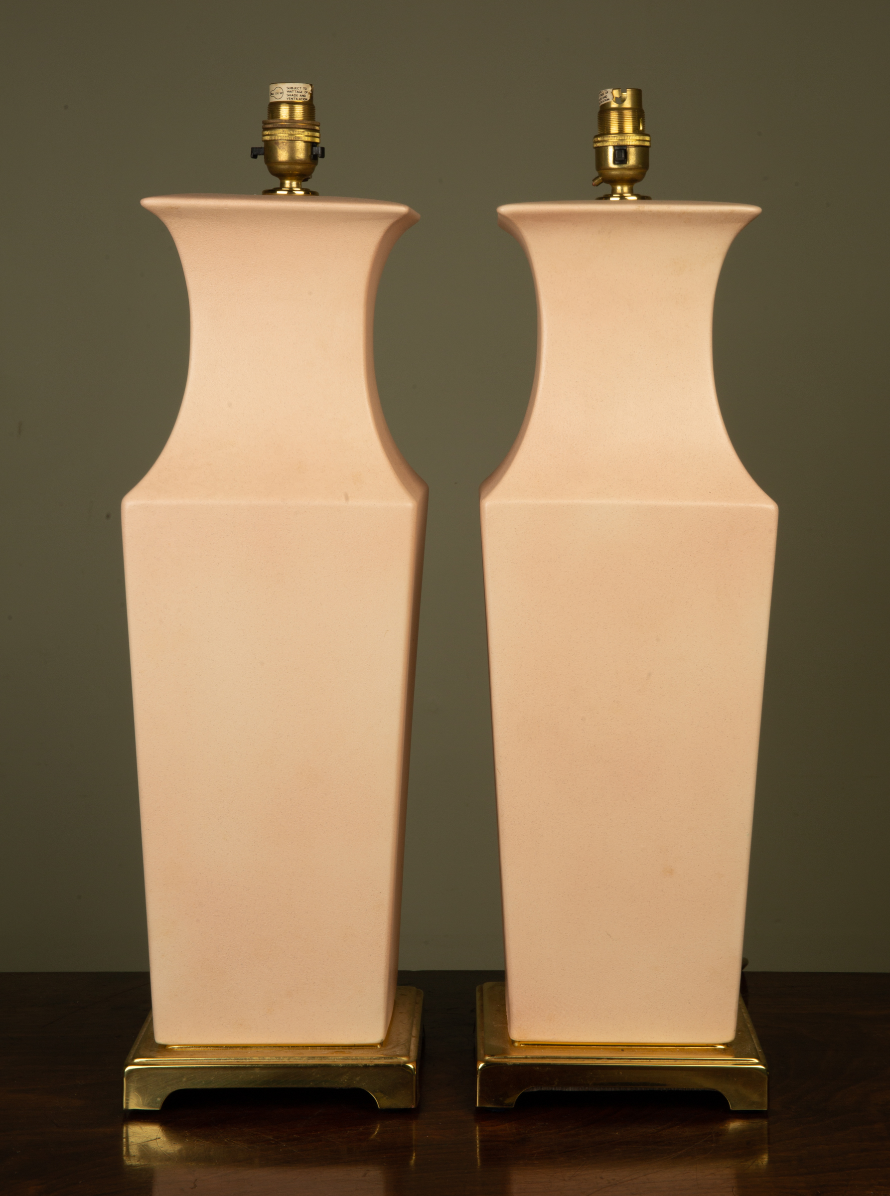 Appraisal: A pair of contemporary ceramic pink glazed square tapering section