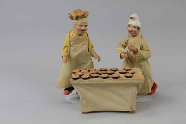 Appraisal: INTERESTING ENSEMBLE OF BAKERS Appealing arrangement consisting of two character