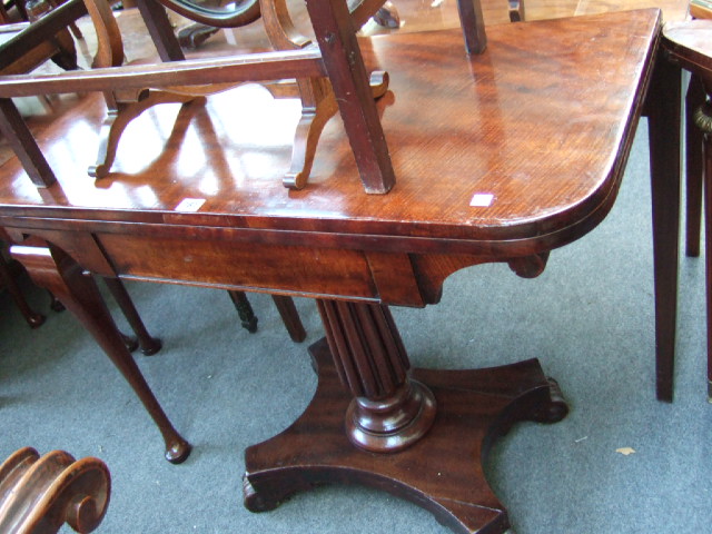 Appraisal: A Victorian mahogany pedestal card table the fold out top