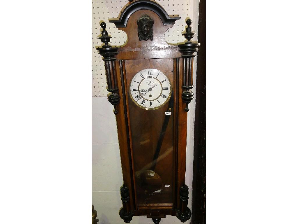 Appraisal: A walnut case Vienna regulator wall clock with applied and