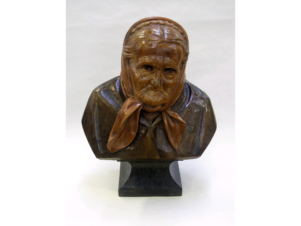 Appraisal: Carved wooden portrait bust of an old woman wearing a