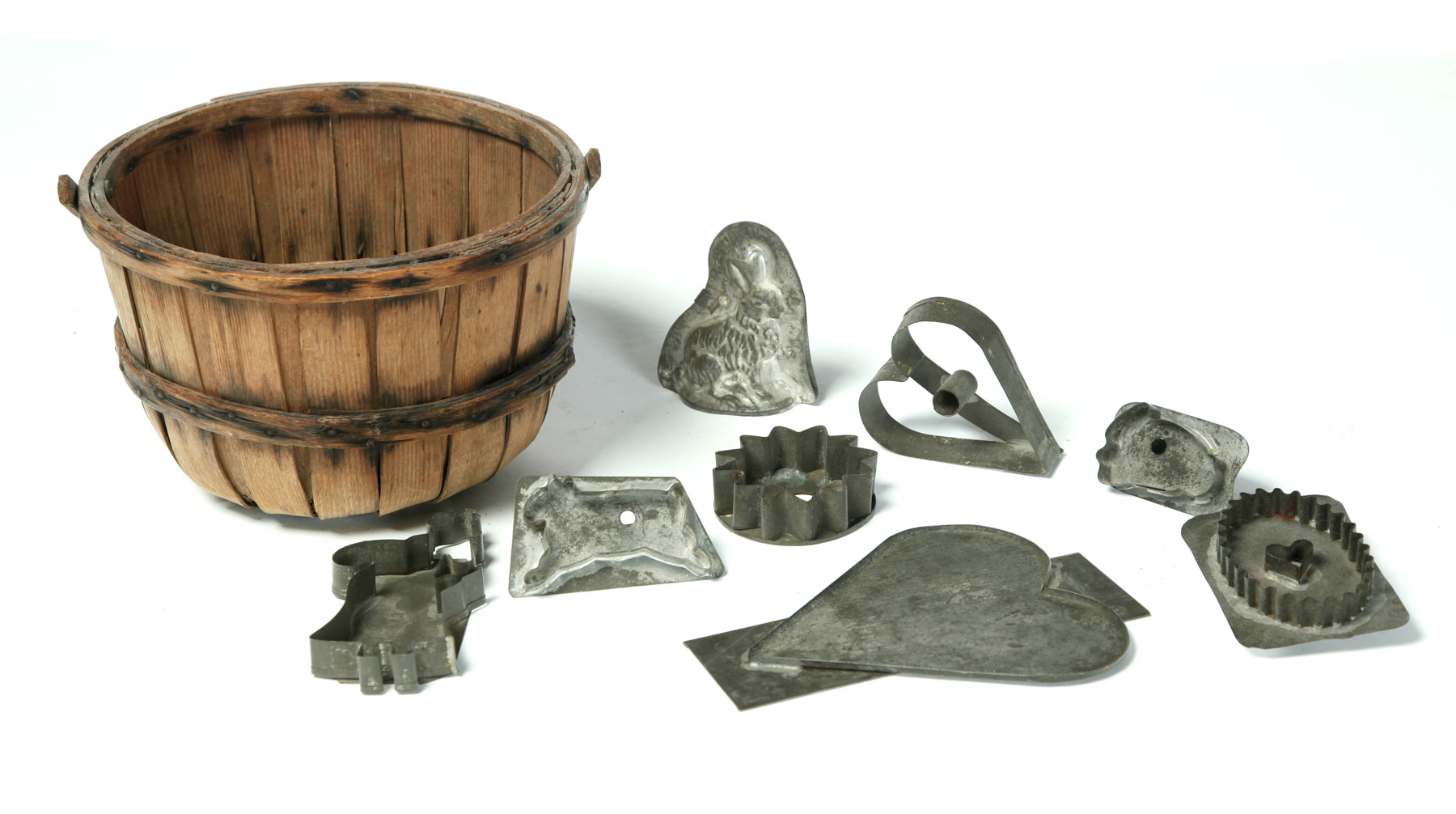 Appraisal: TIN COOKIE CUTTERS IN A BASKET American early th century