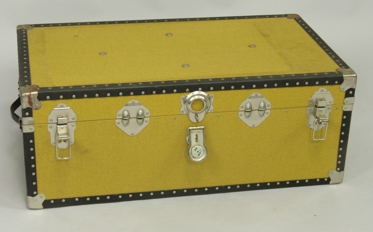 Appraisal: A yellow canvas bound cabin trunk with black trim cm