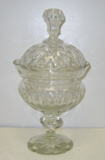 Appraisal: ENGLISH CRYSTAL LIDDED COMPOTE Thumb-print pattern the shouldered bowl with