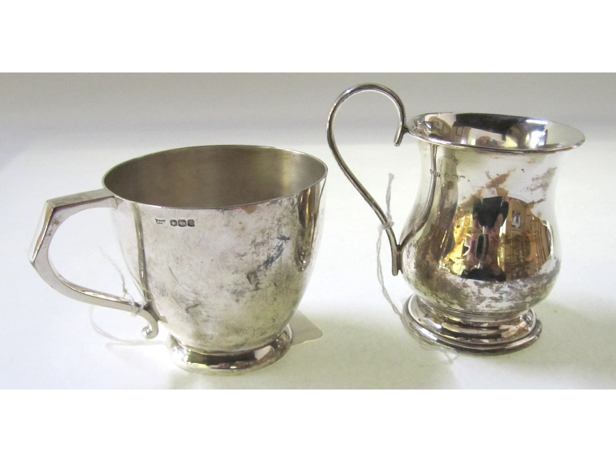 Appraisal: A lot comprising two silver christening mugs Sheffield and Birmingham