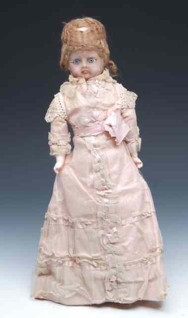 Appraisal: AN ANTIQUE WAX DOLL with composite arms and body and