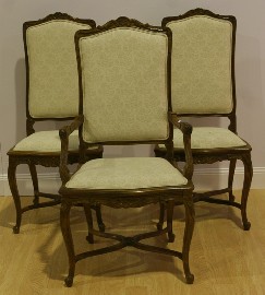 Appraisal: A set of twelve French Provincial chairs including two carvers