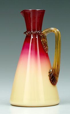 Appraisal: Wheeling peachblow claret jug glossy finish applied reeded amber handle