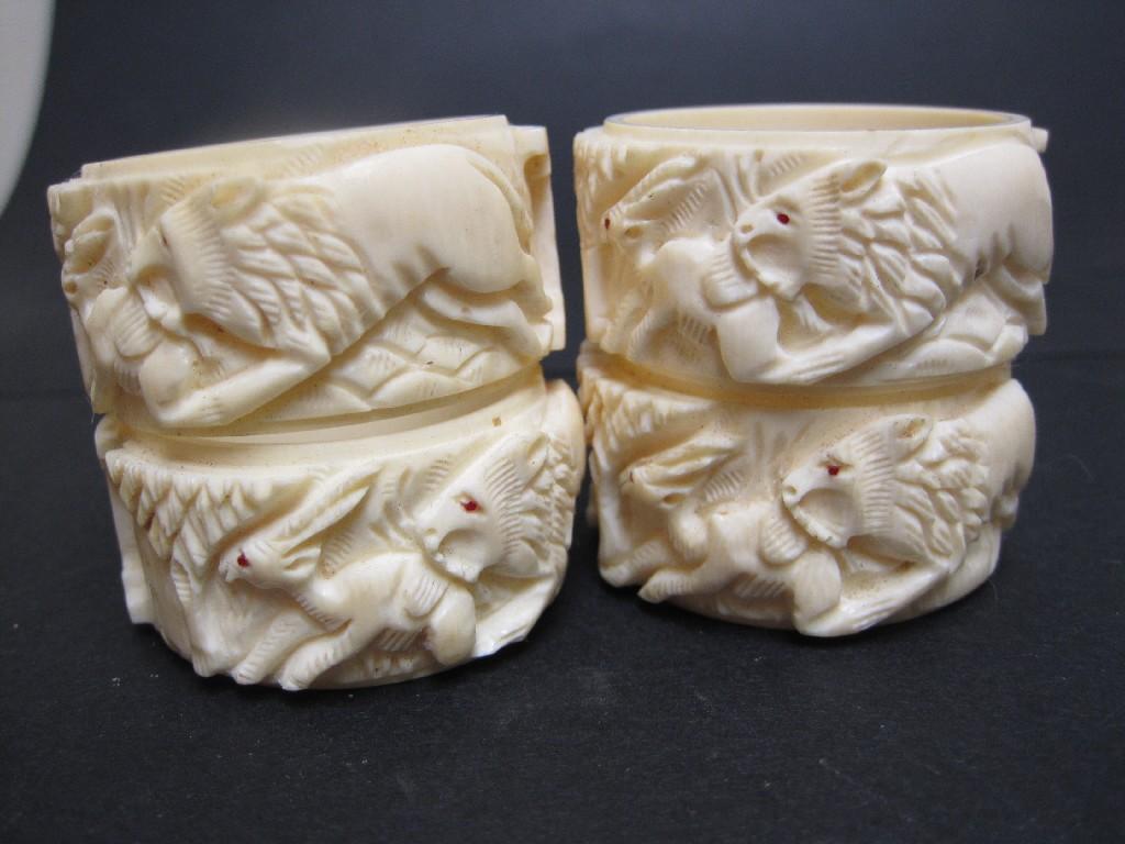 Appraisal: Four ivory Napkin Rings carved lions hunting etc