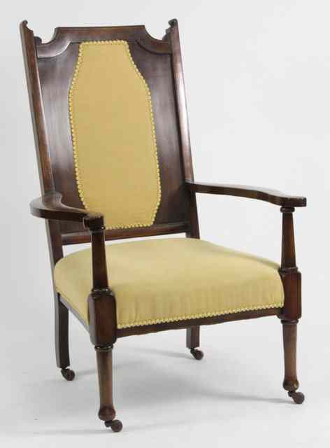 Appraisal: An Edwardian mahogany open armchair with padded back and on