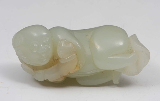 Appraisal: A Chinese pale celadon jade figure of a youth with