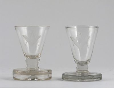 Appraisal: Masonic interest a near pair of firing glasses engraved with