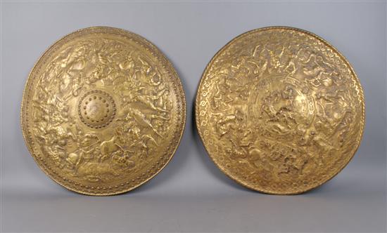 Appraisal: A Group of Two Stamped Brass Shields Diameter inches