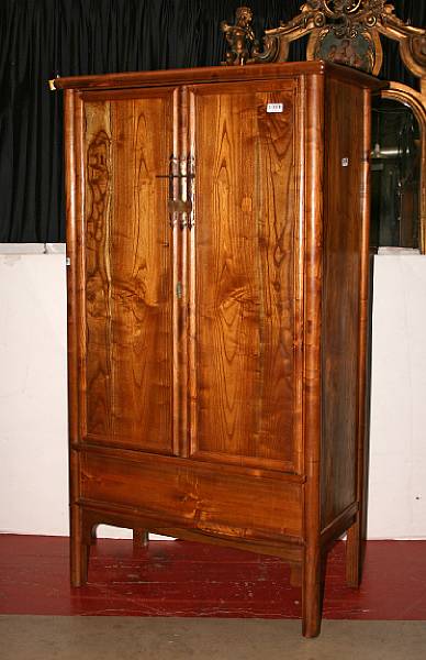 Appraisal: A two-door round-corner wood cabinet With removable center stile two