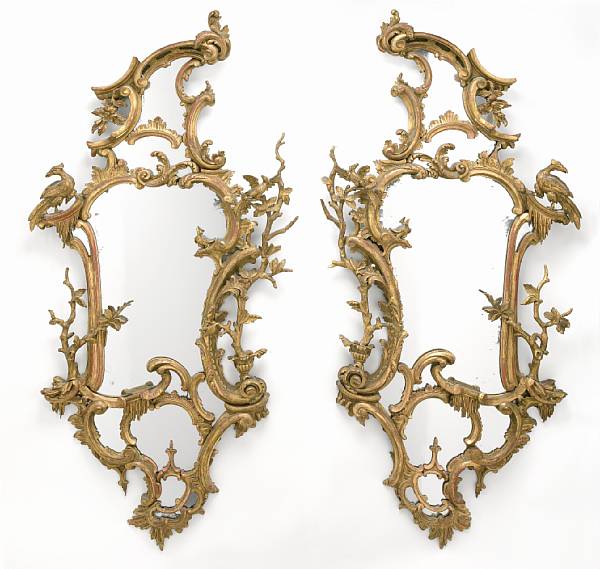 Appraisal: A pair of George III style carved giltwood mirrors late