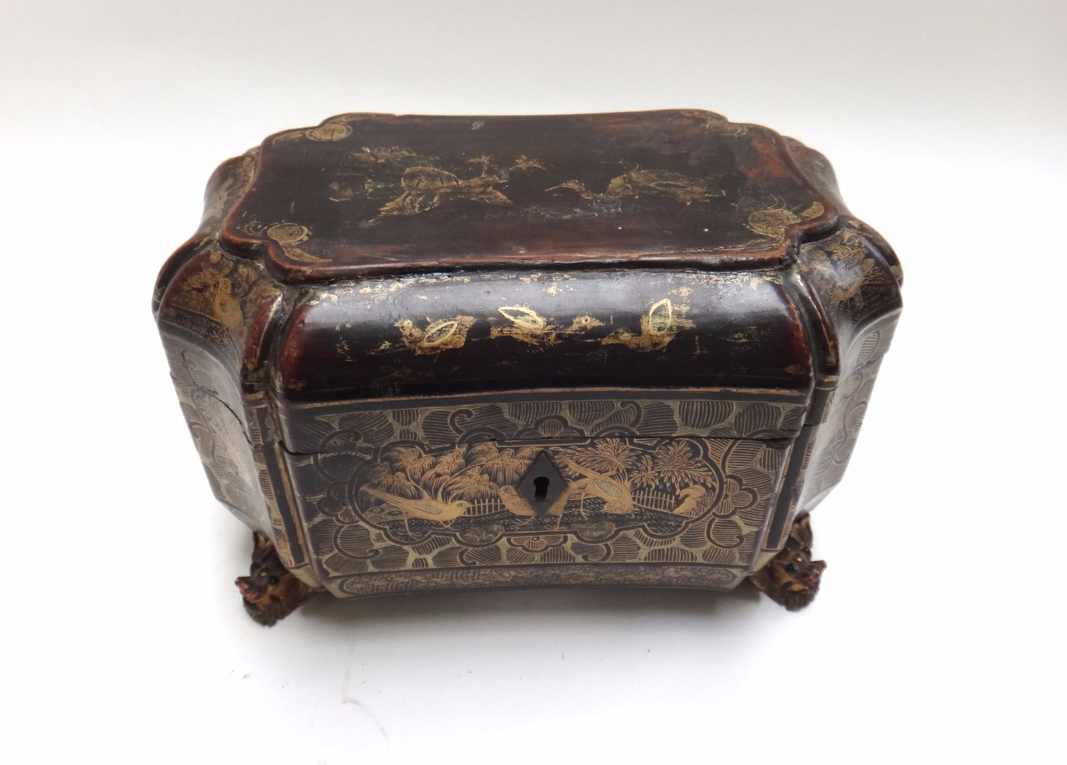 Appraisal: An early Victorian black lacquer chinoiserie decorated tea caddy of