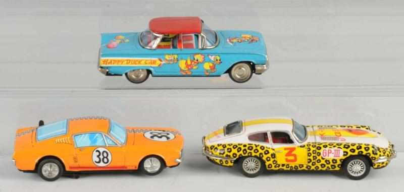 Appraisal: Lot of Tin Automobile Friction Toys Description Japanese Working Includes