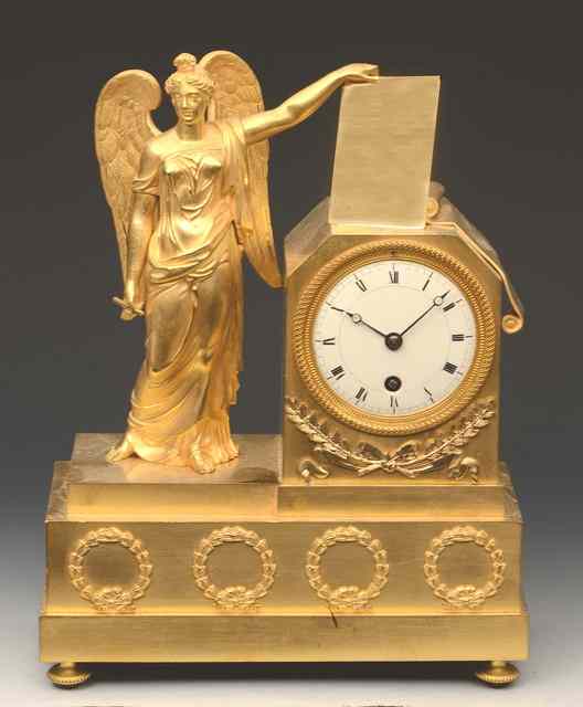 Appraisal: A TH CENTURY FRENCH GILDED METAL MANTEL TIMEPIECE with white