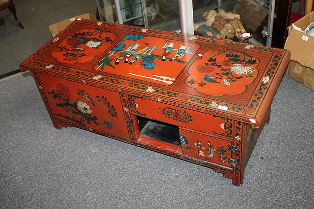 Appraisal: A CONTEMPORARY CHINESE RED LACQUER LOW CHEST the top decorated