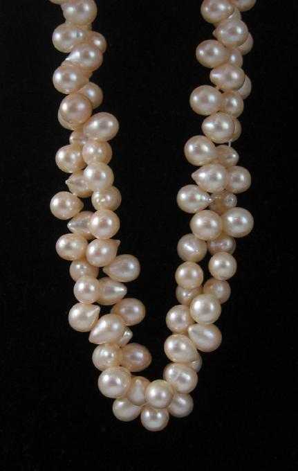 Appraisal: DOUBLE STRAND PINK PEARL NECKLACE measuring inches in length and