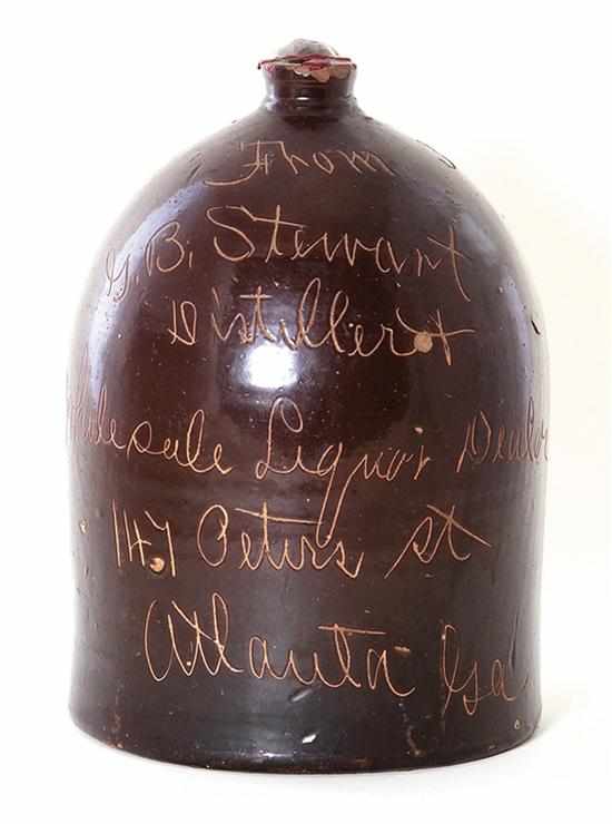 Appraisal: Southern stoneware distillery jug ovoid form with strap handle body