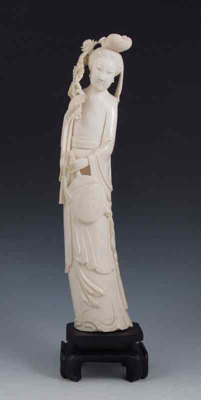 Appraisal: CHINESE CARVED IVORY FIGURE Beautifully detailed from her hair to