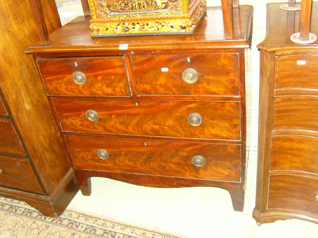 Appraisal: A small th century mahogany chest fitted with long and